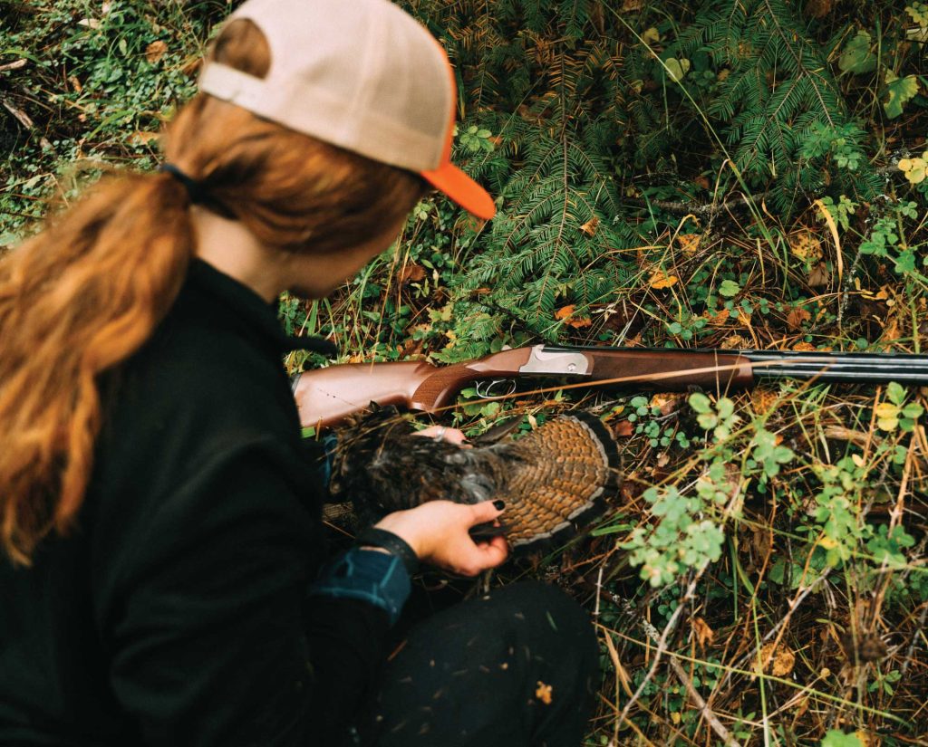 Woman hunter with an upland bird