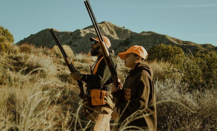 Ruben Mata hunting quail with his son. 
