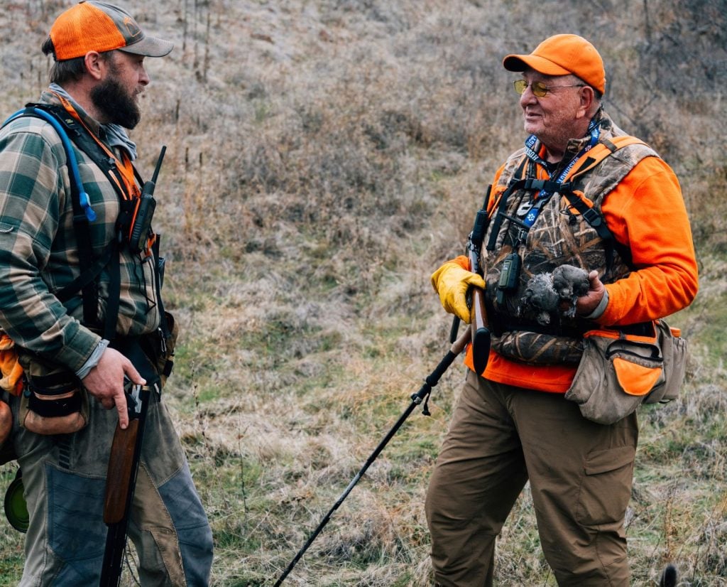 A son talks to his elderly father while hunting quail in Oregon.