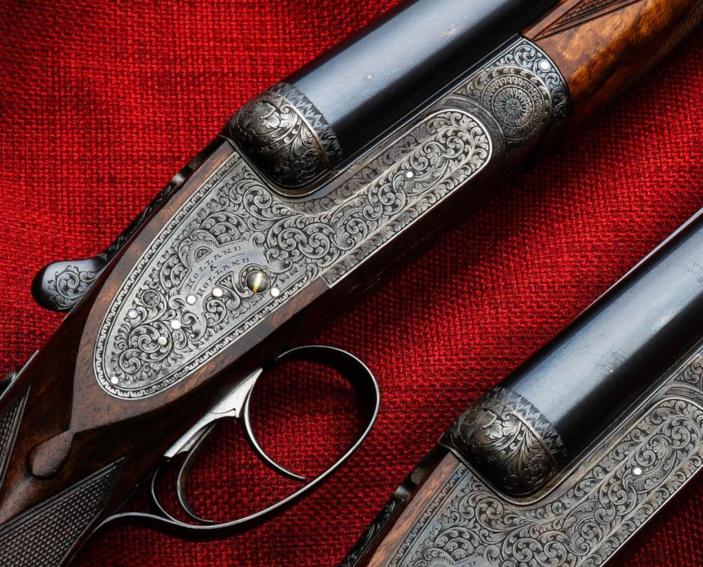 Royal engraving on two Holland & Holland side-by-side shotguns.