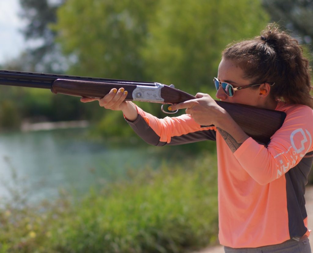 A bird hunter practices shooting a shotgun during the hunting offseason.