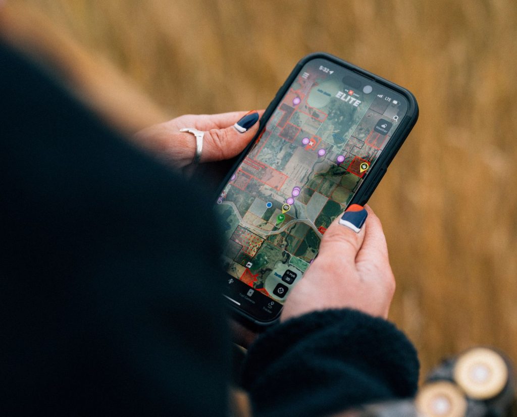 A hunter using onX Hunt to identify private land boundaries while hunting birds on private land. 