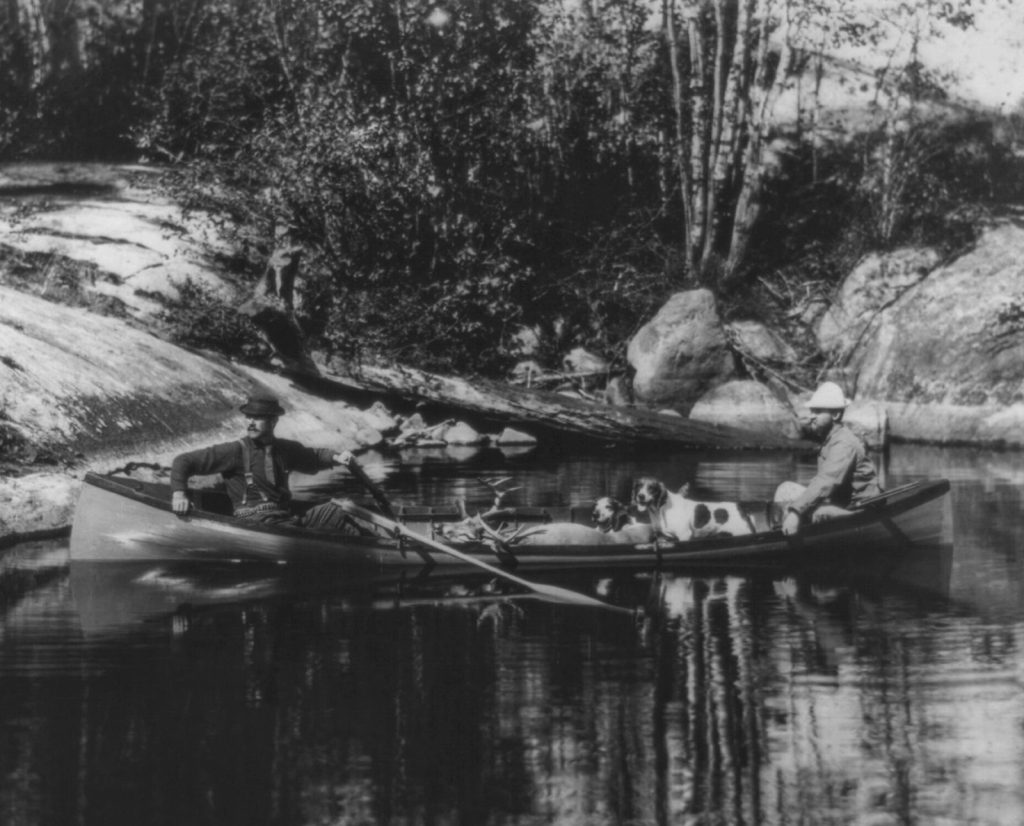 Federal public hunting ground deer hunters in New York's Adirondack Park in 1891 with their hunting dogs. 