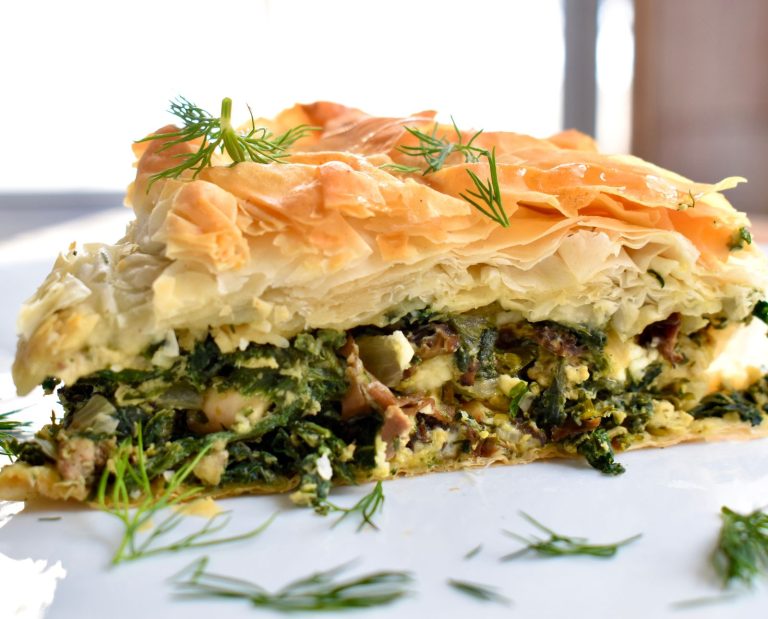 Skillet spanakopita pie with ruffed grouse, morels, and nettles.