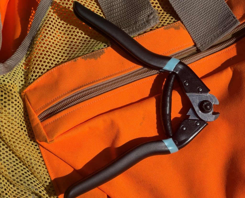 A bird hunter checked his bird hunting gear list and remembered to bring wire cutters in case his dog gets caught in a snare.