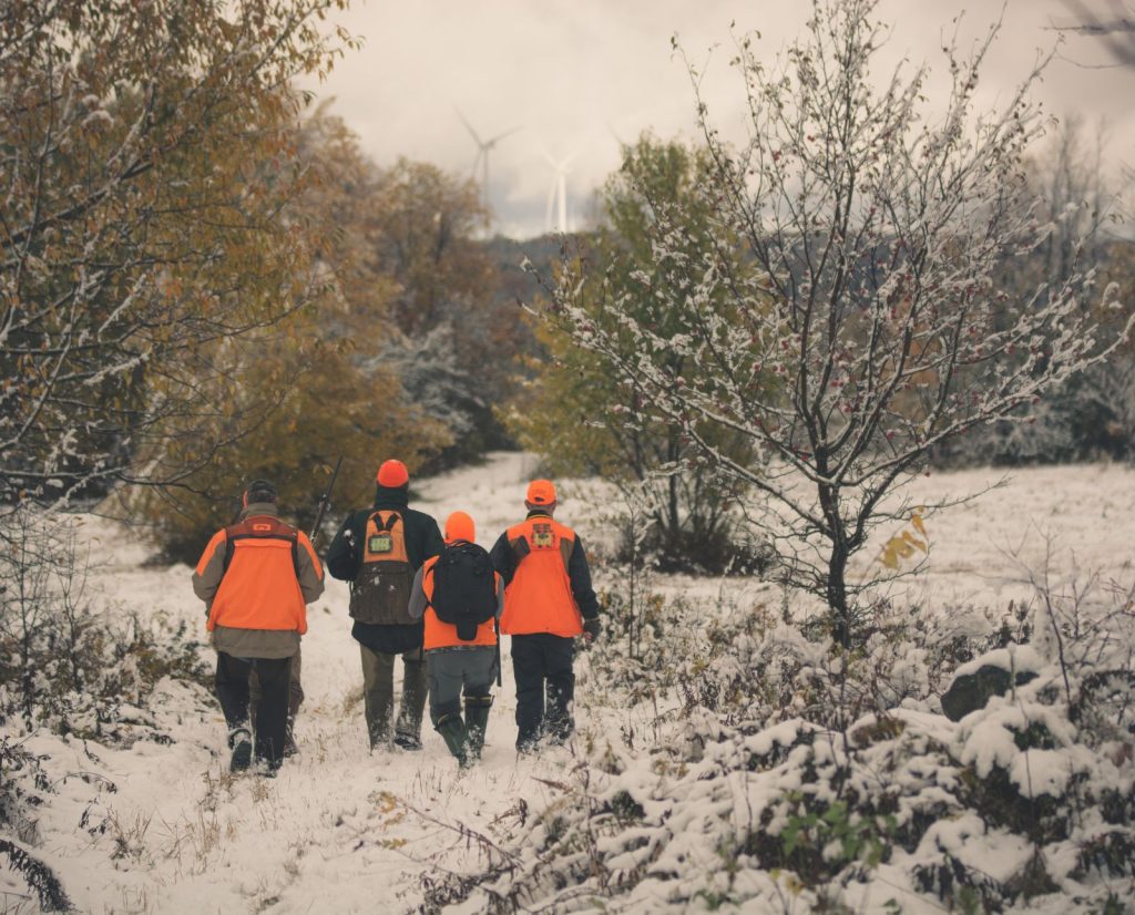 Five small game hunters all hunting together during their small game hunting camp tradition.